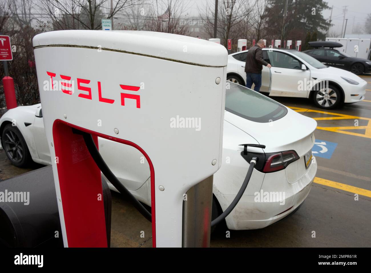 Tesla vehicles are charged at a Tesla charging station in Pittsburgh on ...