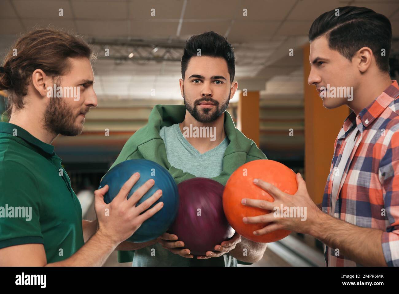Group of men with balls in bowling club Stock Photo Alamy