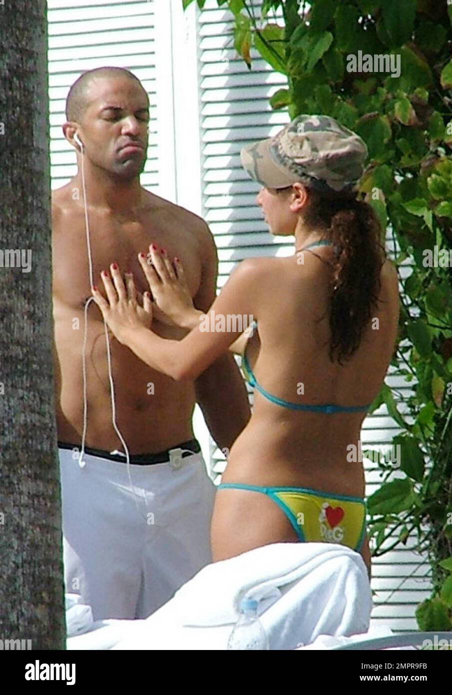 Exclusive!! UK singing star Craig David gets hot with his lady friend at a Miami hotel, 1/4/06 All Stock Photo