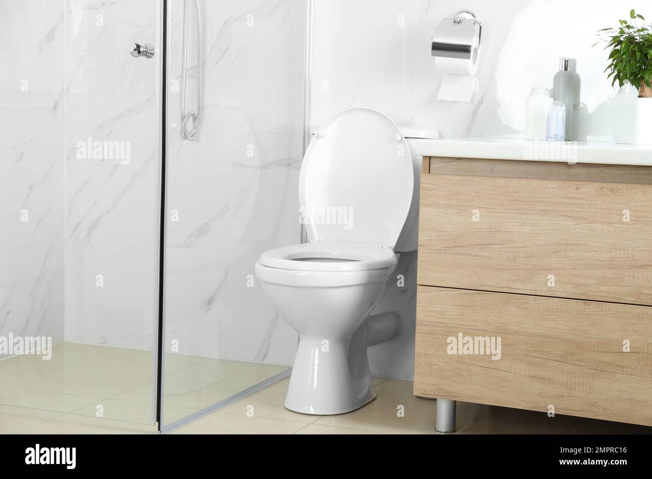 Stylish toilet bowl in modern bathroom interior Stock Photo - Alamy