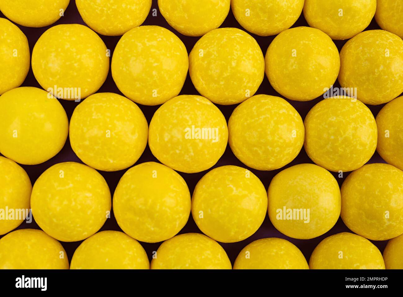 Delicious lemon chewing gums as background, top view Stock Photo Alamy