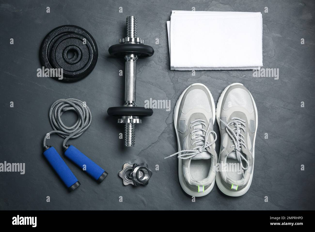 Gym equipment on black background, flat lay Stock Photo