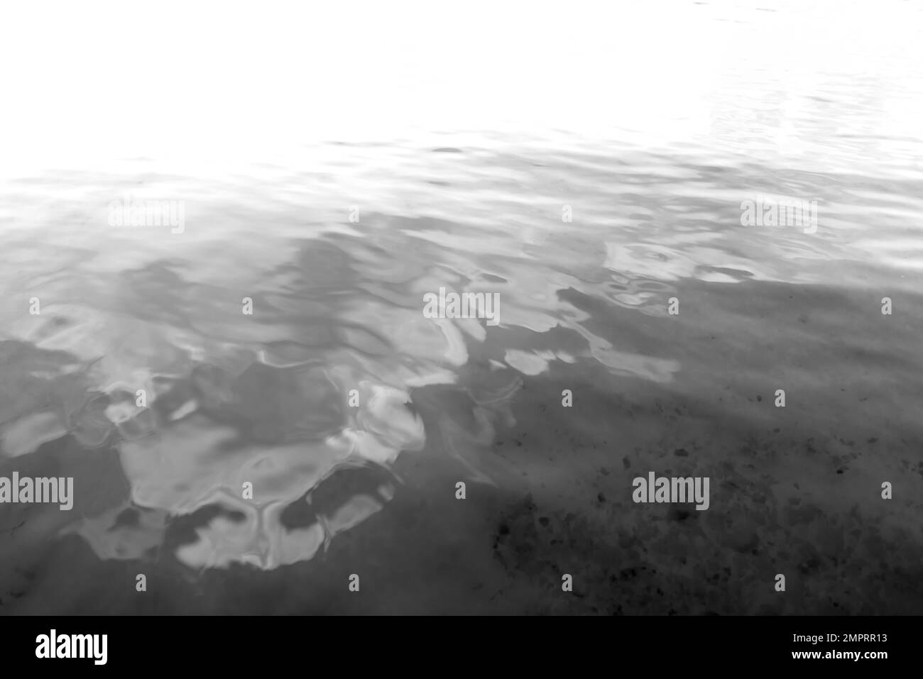 Abstract black and white photo of the surface of the water with the ...