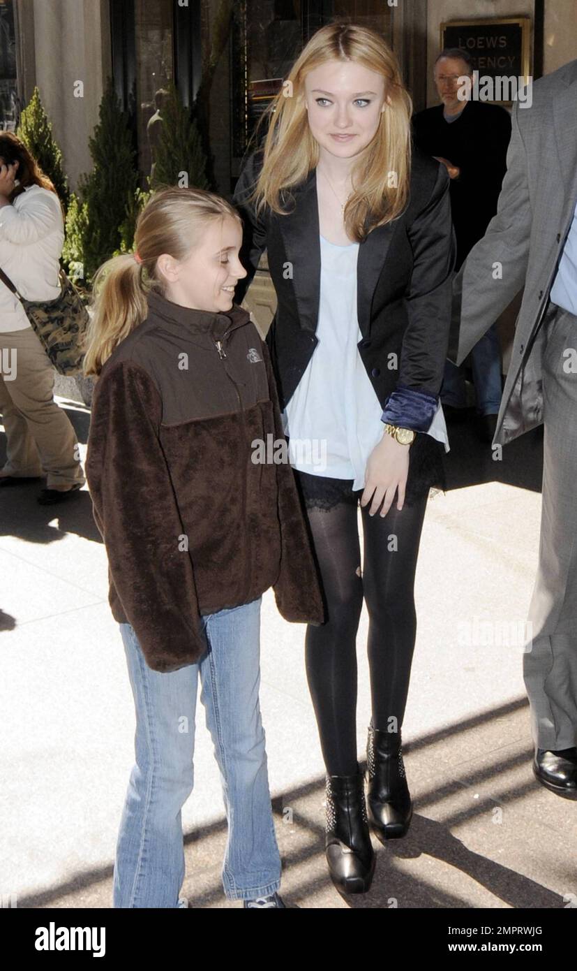 Dakota Fanning signs autographs and poses for photos with fans while