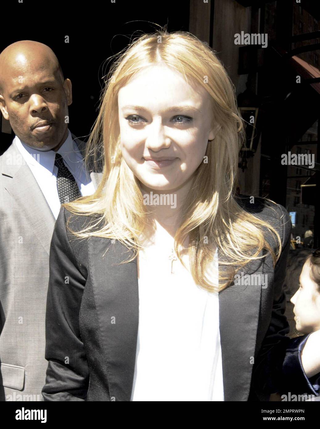 Dakota Fanning signs autographs and poses for photos with fans while