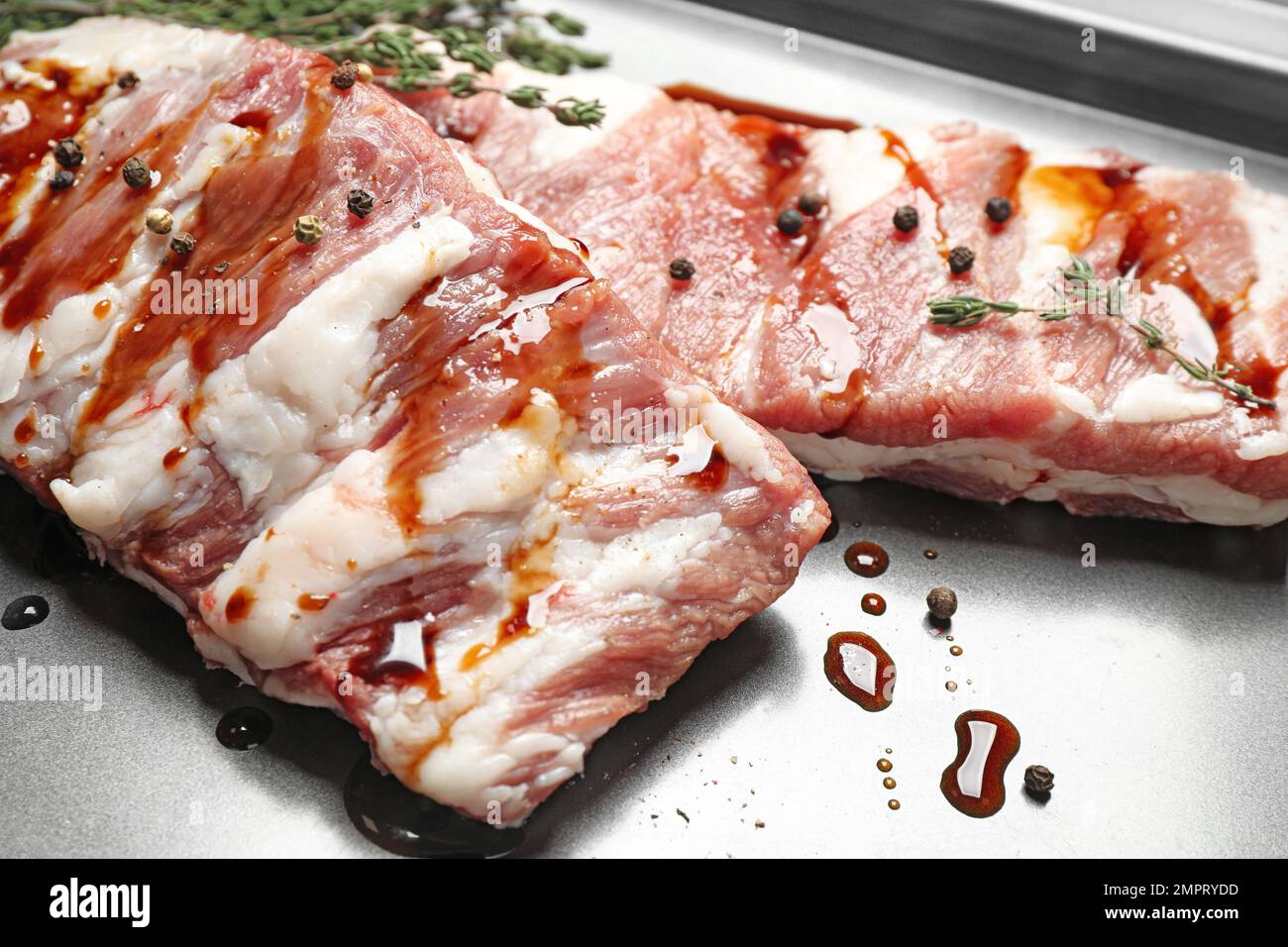 External Ribs On Sheet Fresh raw ribs on baking sheet, closeup Stock Photo - Alamy