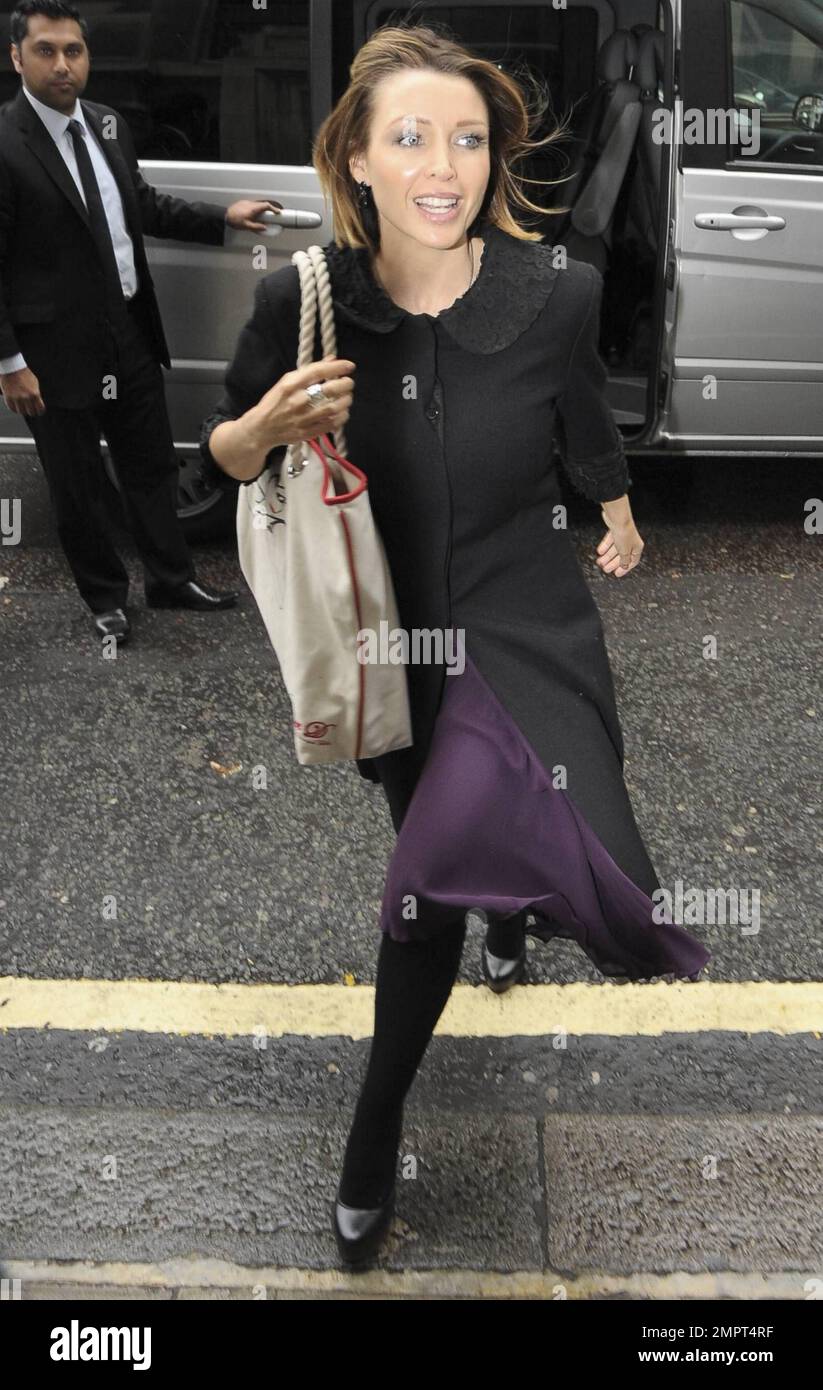 Actress, singer and new mom Danni Minogue flips her hair out of her face as  she arrives at BBC Radio 2 for an afternoon interview on the Steve Wright  in the Afternoon