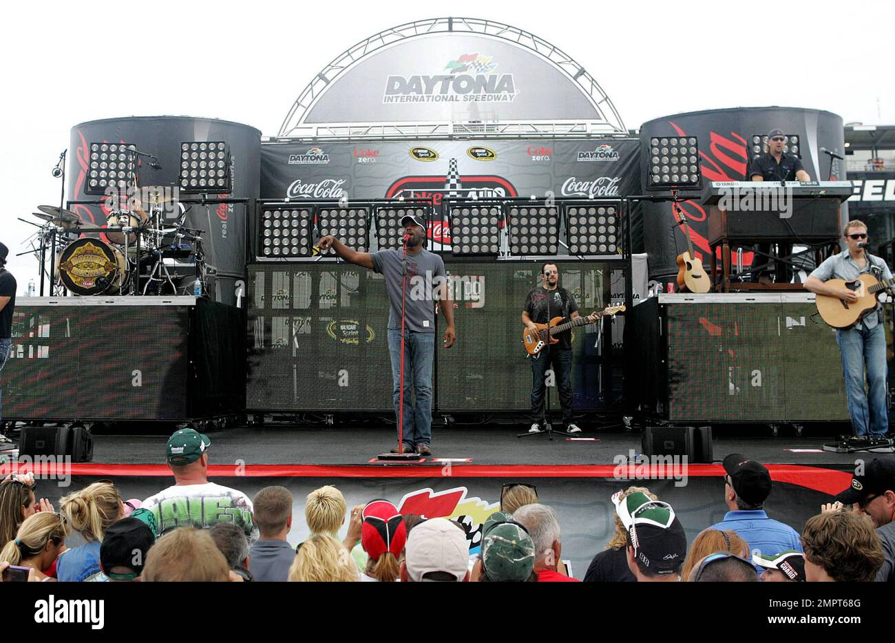 Lead singer of Hootie & the Blowfish and CMA New Artist of the Year winner, Darius Rucker performs live in the rain prior to the NASCAR Coke Zero 400 at Daytona International Speedway.  Despite the drizzle the rock-turned-country singer seemed happy as he moved around the stage singing and playing his guitar. Daytona Beach, FL. 07/03/10. Stock Photo