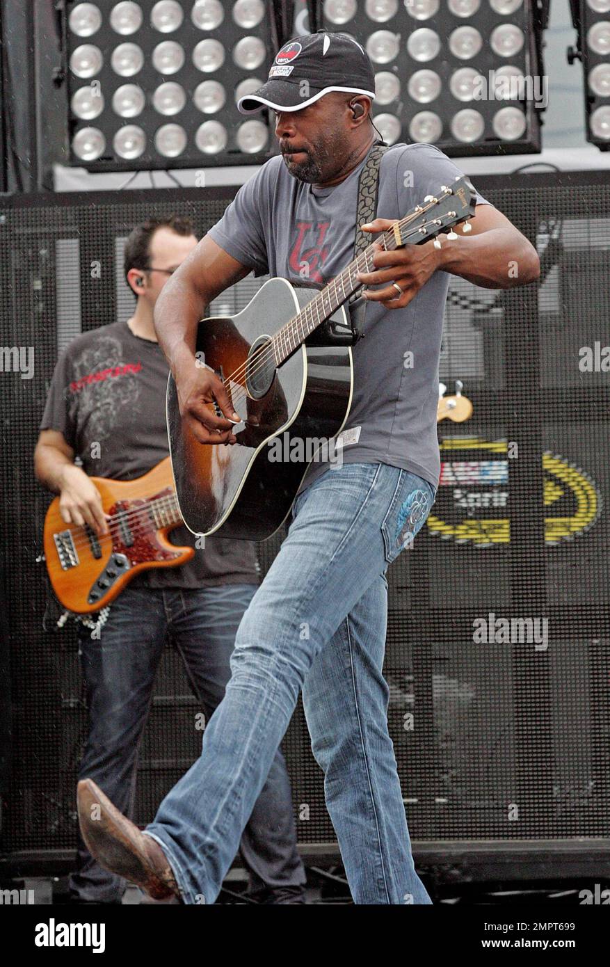 Lead singer of Hootie & the Blowfish and CMA New Artist of the Year winner, Darius Rucker performs live in the rain prior to the NASCAR Coke Zero 400 at Daytona International Speedway.  Despite the drizzle the rock-turned-country singer seemed happy as he moved around the stage singing and playing his guitar. Daytona Beach, FL. 07/03/10.   . Stock Photo