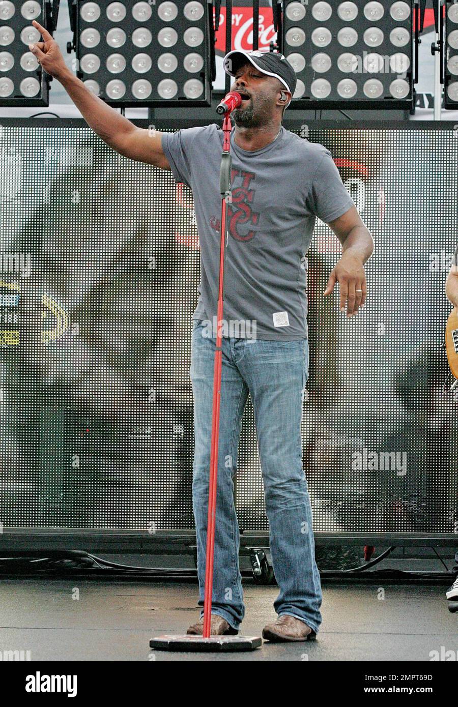 Lead singer of Hootie & the Blowfish and CMA New Artist of the Year winner, Darius Rucker performs live in the rain prior to the NASCAR Coke Zero 400 at Daytona International Speedway.  Despite the drizzle the rock-turned-country singer seemed happy as he moved around the stage singing and playing his guitar. Daytona Beach, FL. 07/03/10.   . Stock Photo