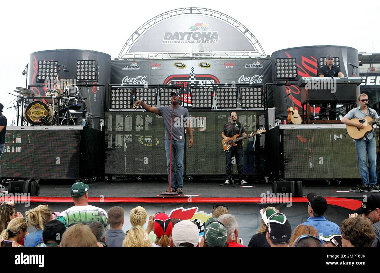 Lead singer of Hootie & the Blowfish and CMA New Artist of the Year winner, Darius Rucker performs live in the rain prior to the NASCAR Coke Zero 400 at Daytona International Speedway.  Despite the drizzle the rock-turned-country singer seemed happy as he moved around the stage singing and playing his guitar. Daytona Beach, FL. 07/03/10.   . Stock Photo