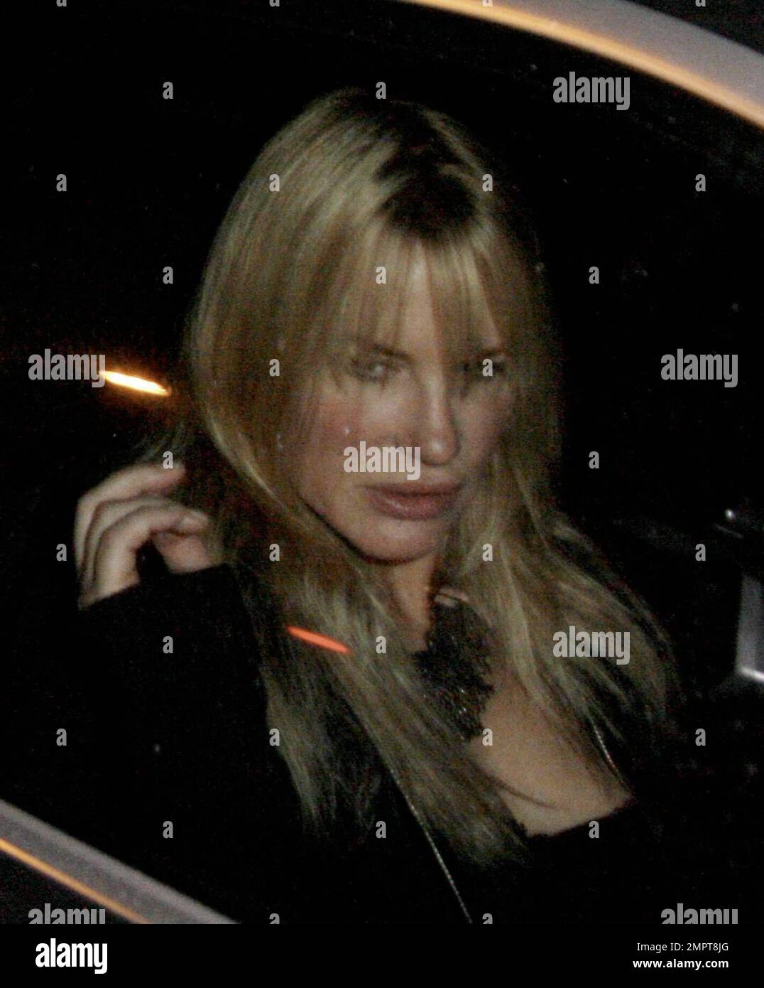 Actress Darryl Hannah leaves Crown Bar out the back door. Once she was