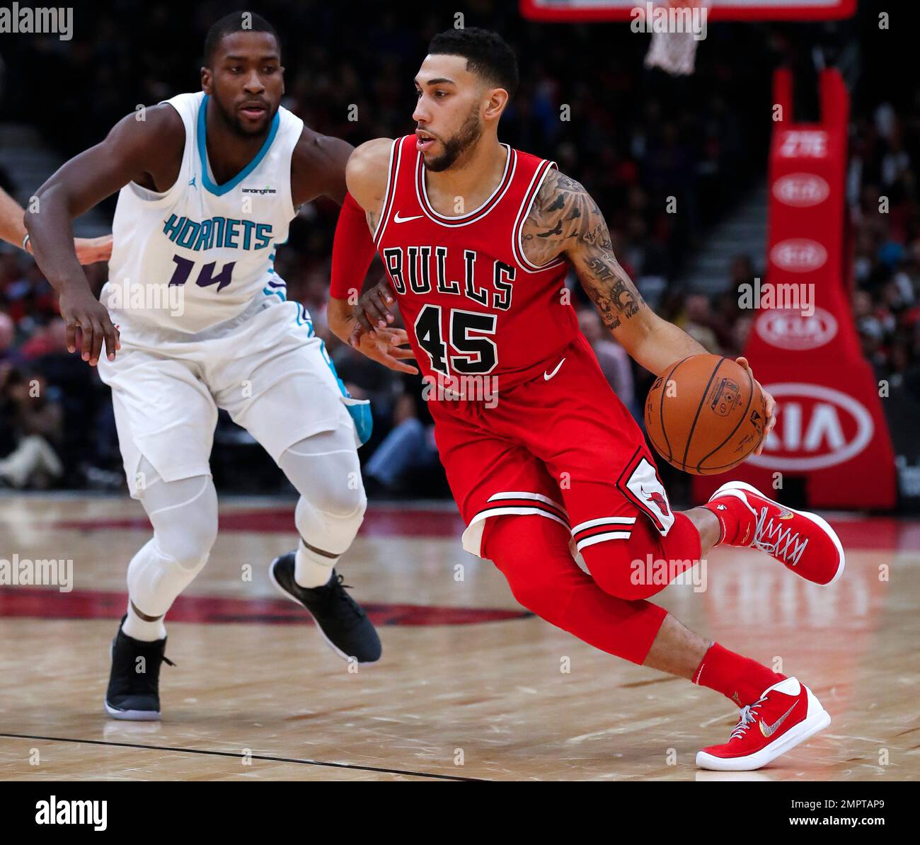 Chicago Bulls' Denzel Valentine, right, is guarded by Charlotte Hornets'  Michael Kidd-Gilchrist during the second half of an NBA basketball game  Friday, Nov. 17, 2017, in Chicago. (AP Photo/Jim Young Stock Photo 