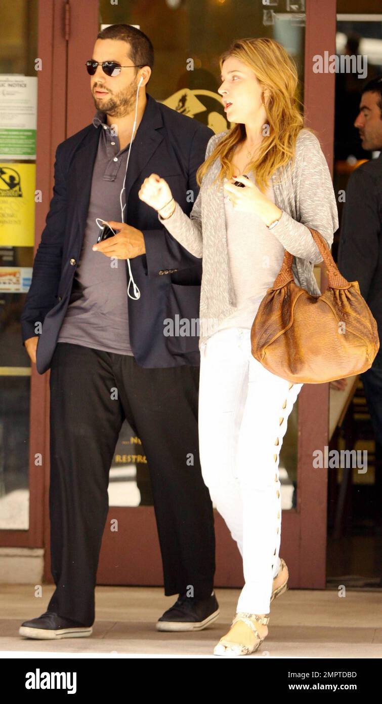 Illusionist David Blaine and reported fiancŽe, French model Alizee Guinochet walk arm-in-arm as they leave The Newsroom after having a quiet lunch together in Los Angeles, CA. 8/13/10. Stock Photo