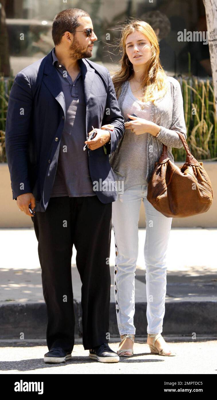 Illusionist David Blaine and reported fiancŽe, French model Alizee Guinochet walk arm-in-arm as they leave The Newsroom after having a quiet lunch together in Los Angeles, CA. 8/13/10. Stock Photo