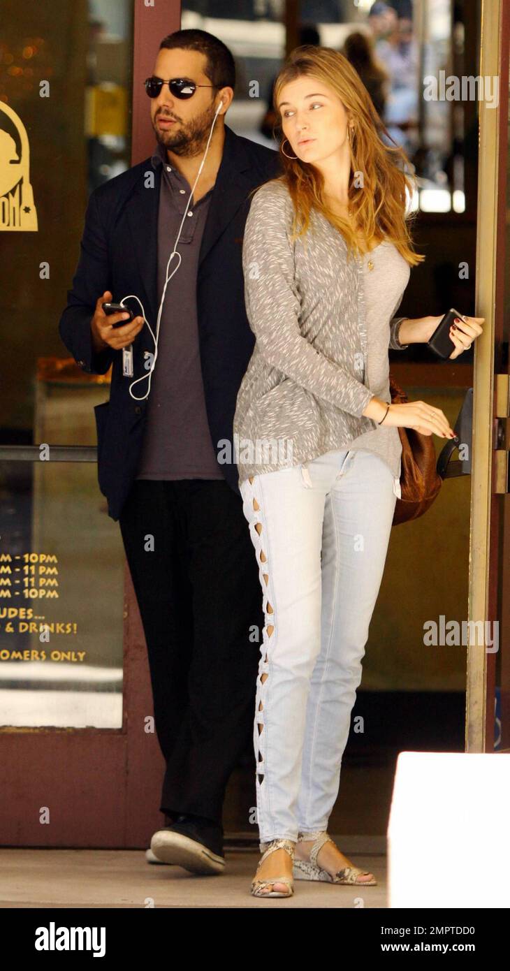 Illusionist David Blaine and reported fiance, French model Alizee Guinochet walk arm-in-arm as they leave The Newsroom after having a quiet lunch together in Los Angeles, CA. 8/13/10. Stock Photo