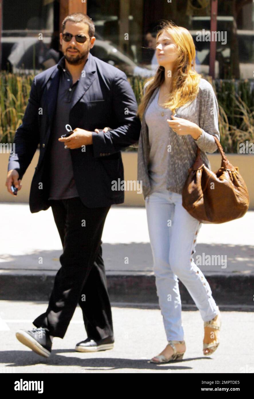 Illusionist David Blaine and reported fiance, French model Alizee Guinochet walk arm-in-arm as they leave The Newsroom after having a quiet lunch together in Los Angeles, CA. 8/13/10. Stock Photo