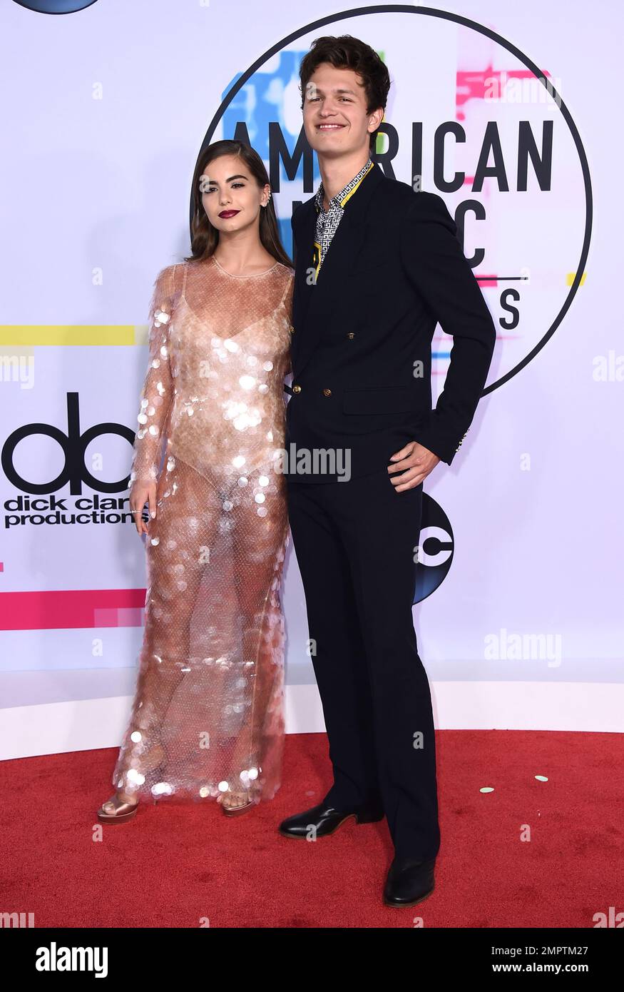 Violetta Komyshan, left, and Ansel Elgort arrive at the American Music