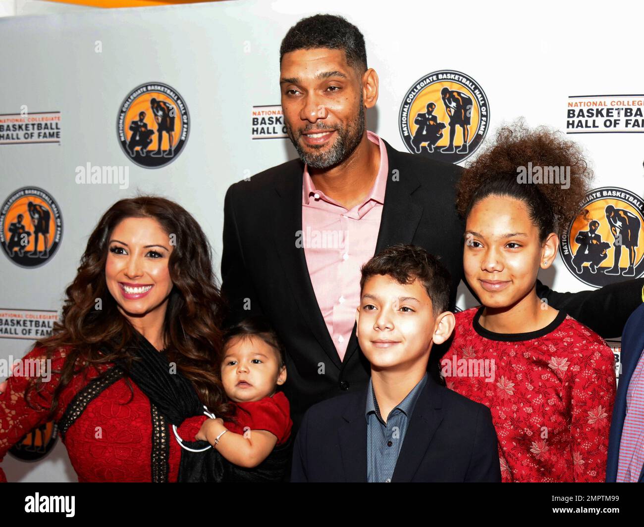 San Antonio Spurs and Wake Forest great, Tim Duncan, top, stops for a photo  with his girlfriend Vanessa Macias, left, and his children during a  National Collegiate Basketball Hall of Fame induction