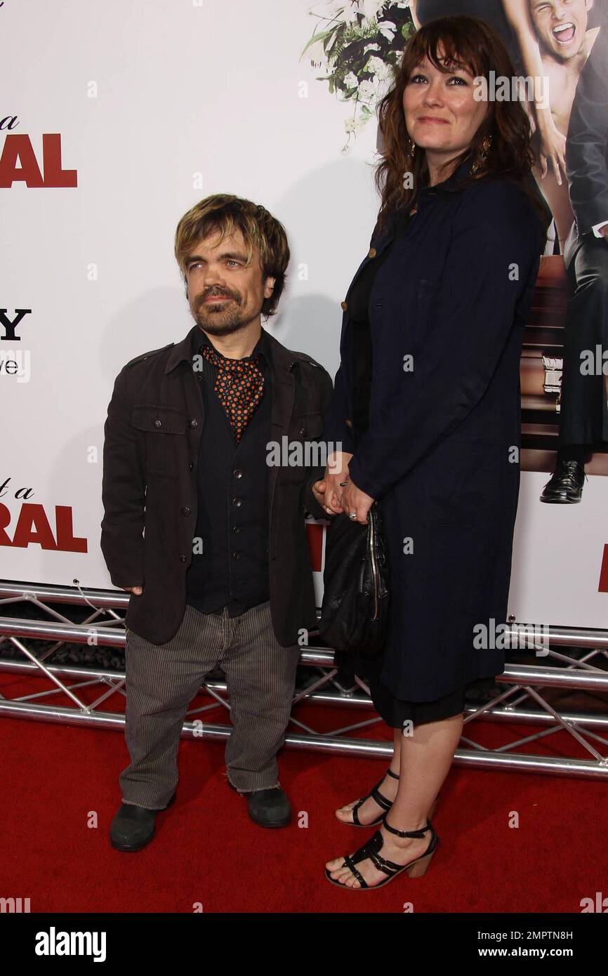 Actor Peter Dinklage and wife Erica Schmidt arrive to the world premiere of  the comedy remake \, image size:866x1390