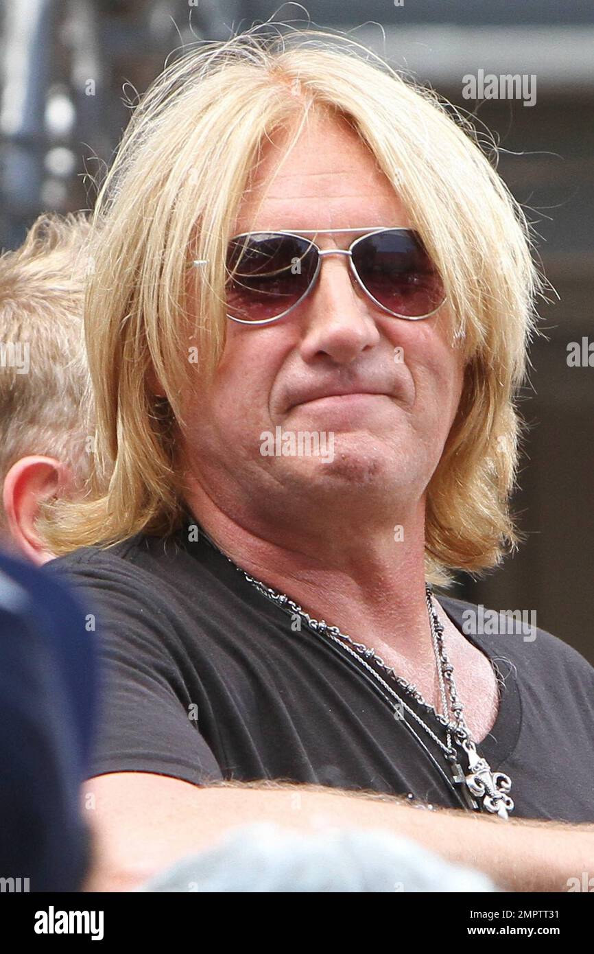 Def Leppard performs an acoustic set during a television appearance at