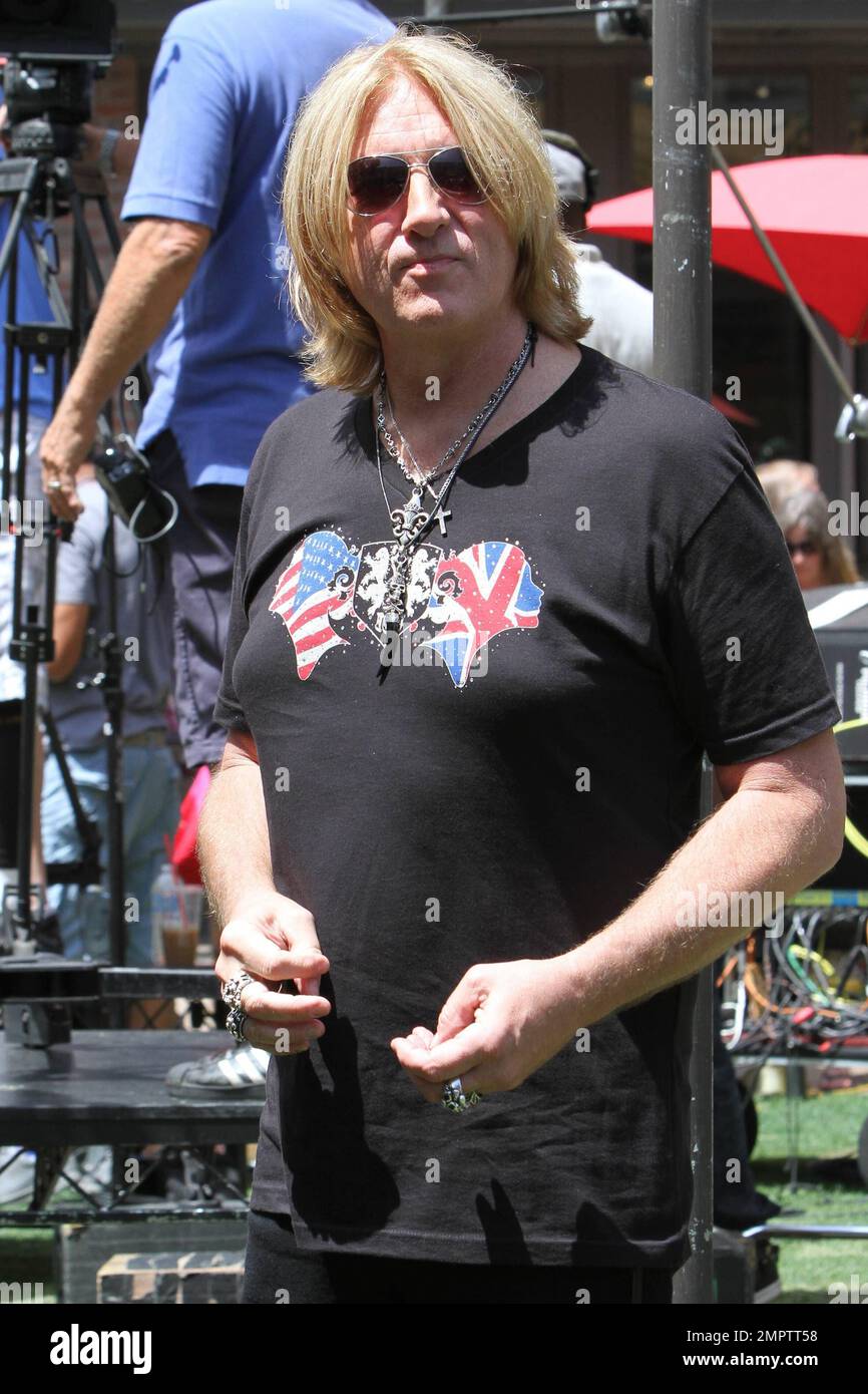 Def Leppard performs an acoustic set during a television appearance at