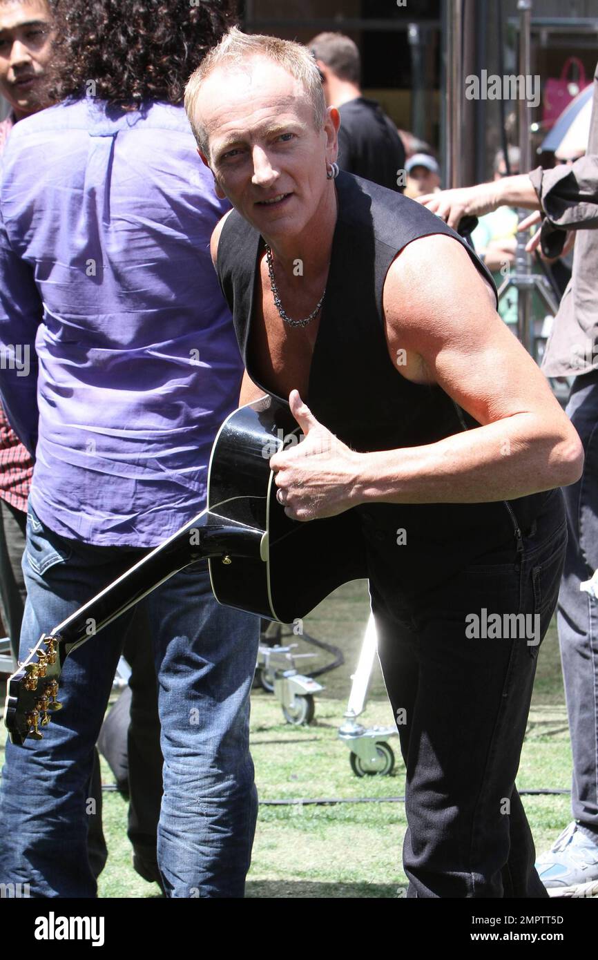 Def Leppard performs an acoustic set during a television appearance at