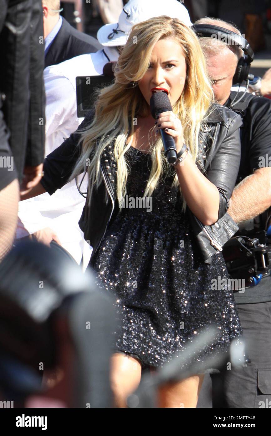 Wearing a black sequenced mini dress with a leather jacket and black ankle boots, singer Demi Lovato performs live the 2012 MTV Video Music Awards held at the Staples Center in Los Angeles, CA. 6th September 2012. Stock Photo