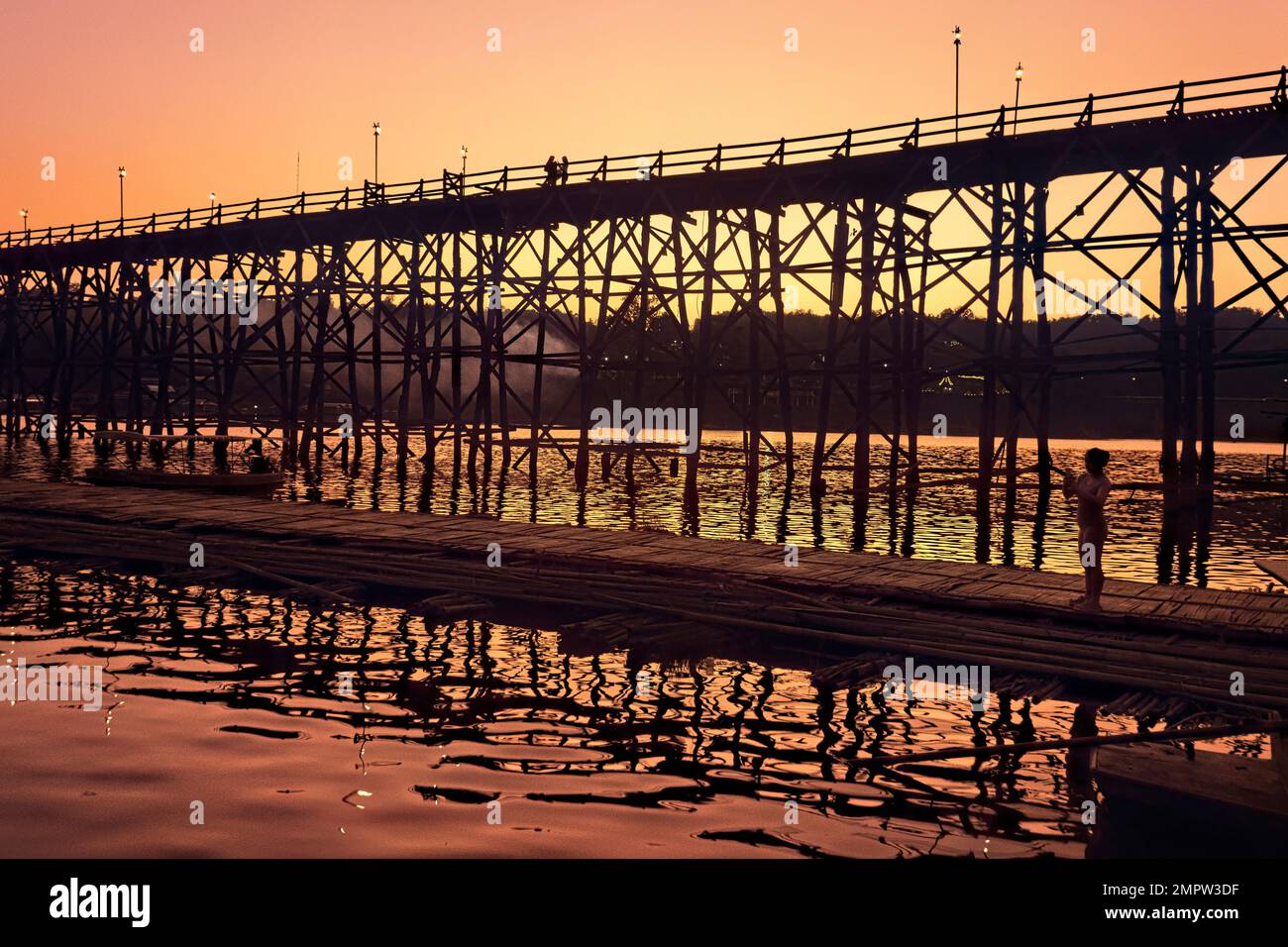 The Wooden Mon Bridge (Uttamanusorn Bridge) at sunset, Sangkhlaburi