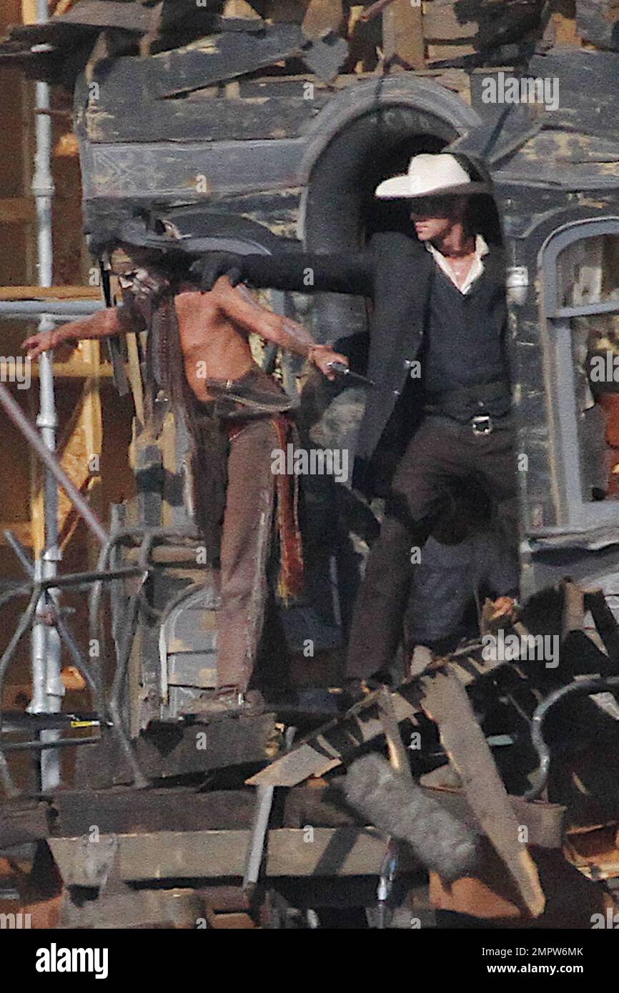 Lone Ranger Hammer Johnny Depp and Armie Hammer, dressed in their characters Tonto and the ...
