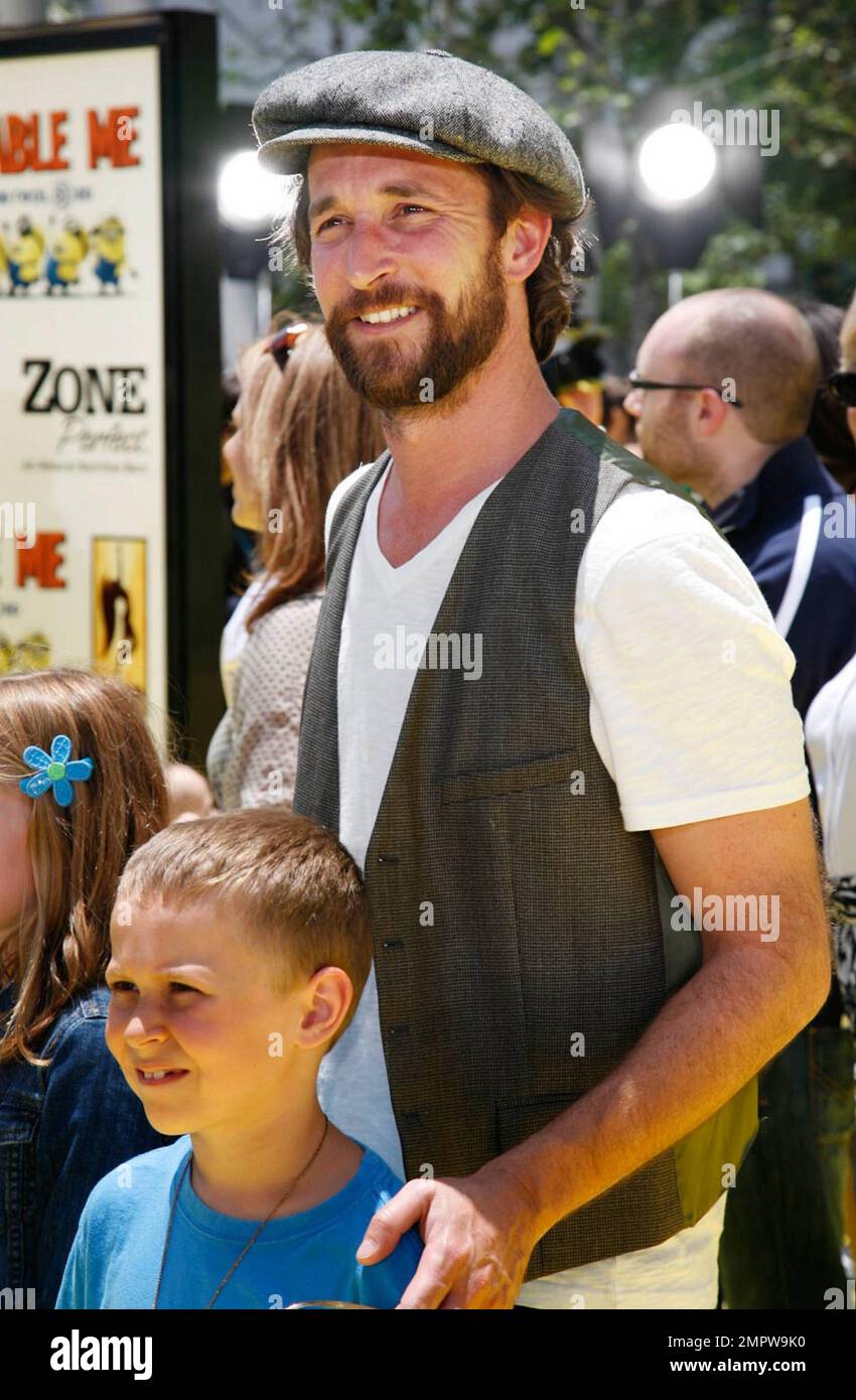 Noah Wyle and family pose on the yellow carpet at the premiere of(08)