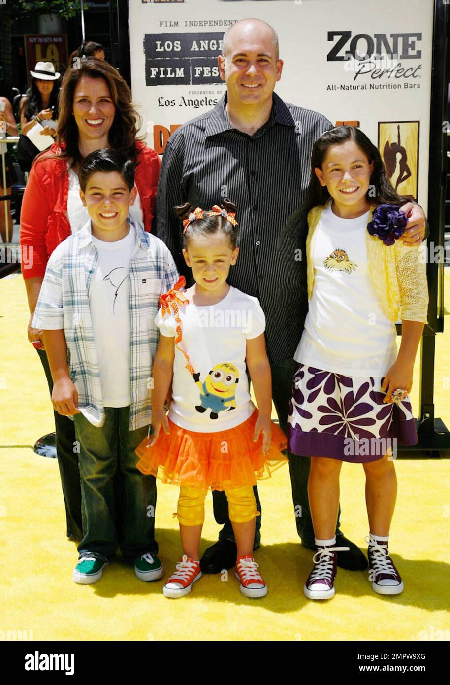Writer Ken Daurio and family pose on the yellow carpet at the premiere of "Despicable Me" held at Nokia Theatre L.A. Live.  Universal Pictures' new 3-D CGI film, which features the voices of Russell Brand, Steve Carell and Julie Andrews, took place during the 2010 Los Angeles Film Festival. Los Angeles, CA. 06/27/10. . Stock Photo