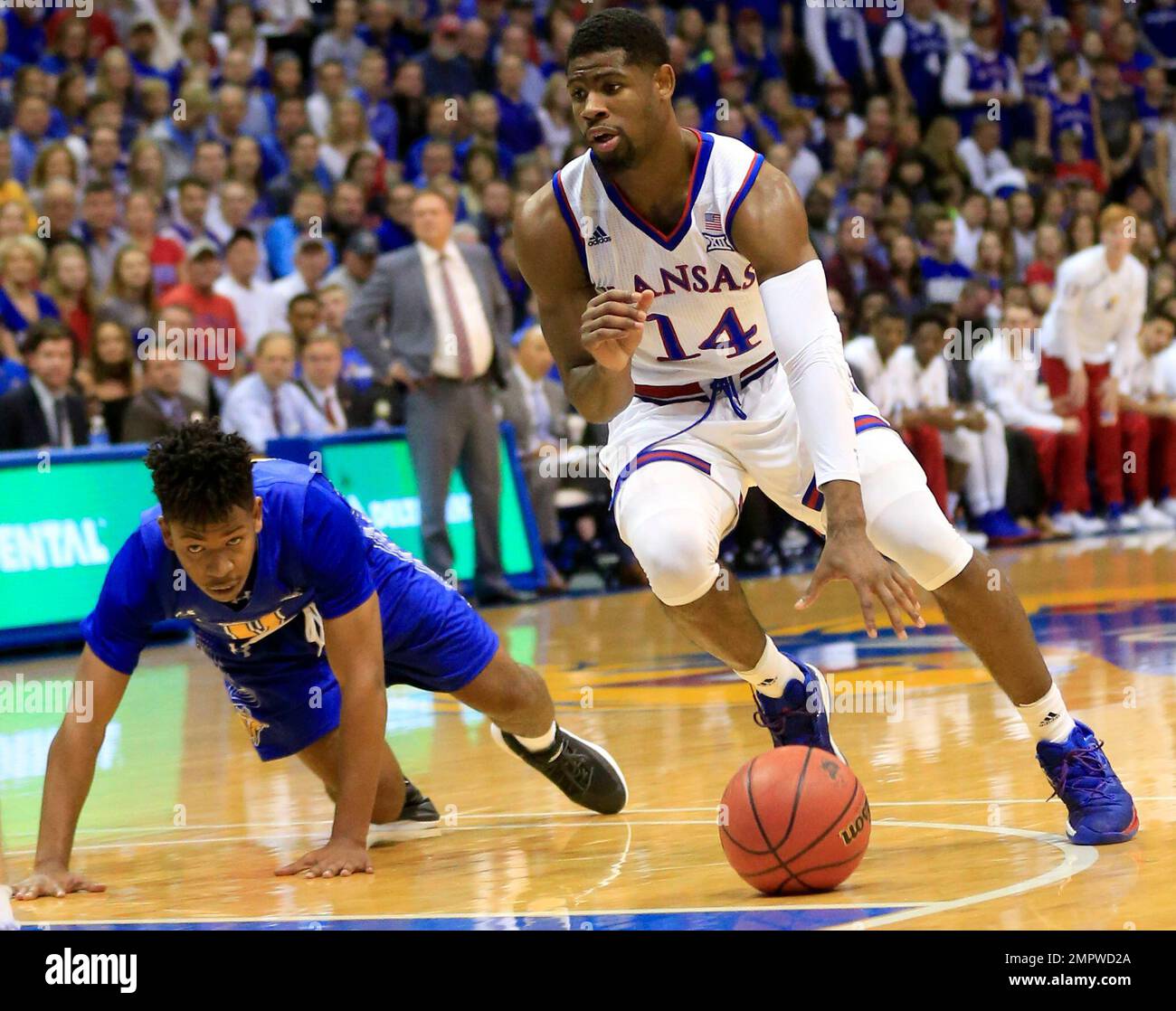 Kansas guard Malik Newman (14) drives past South Dakota State guard ...