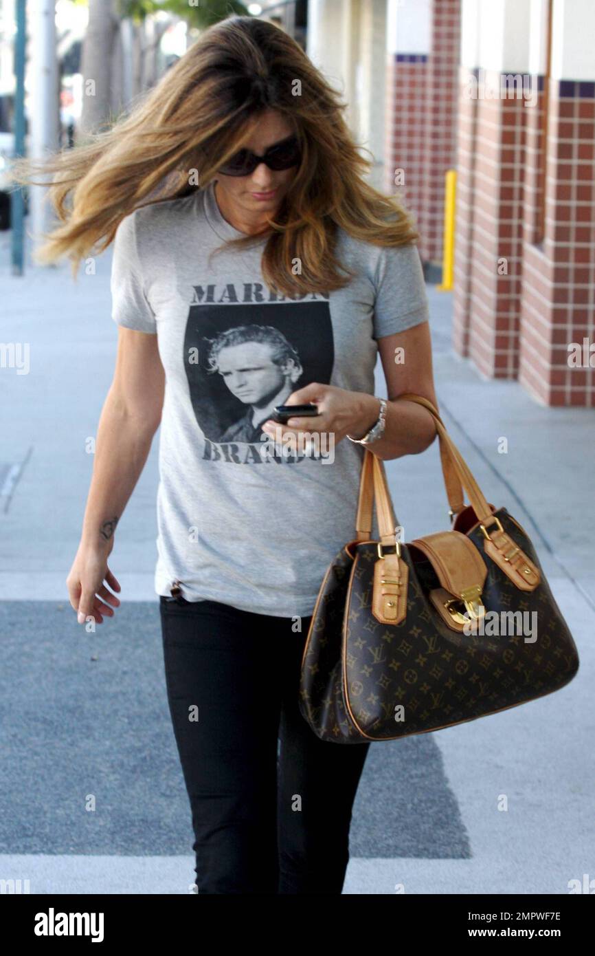 Latin American actress and model Daisy Fuentes wears a Marlon Brando t  shirt as she shows off her luxurious locks while leaving a Beverly Hills  hair salon after an appointment. Los Angeles