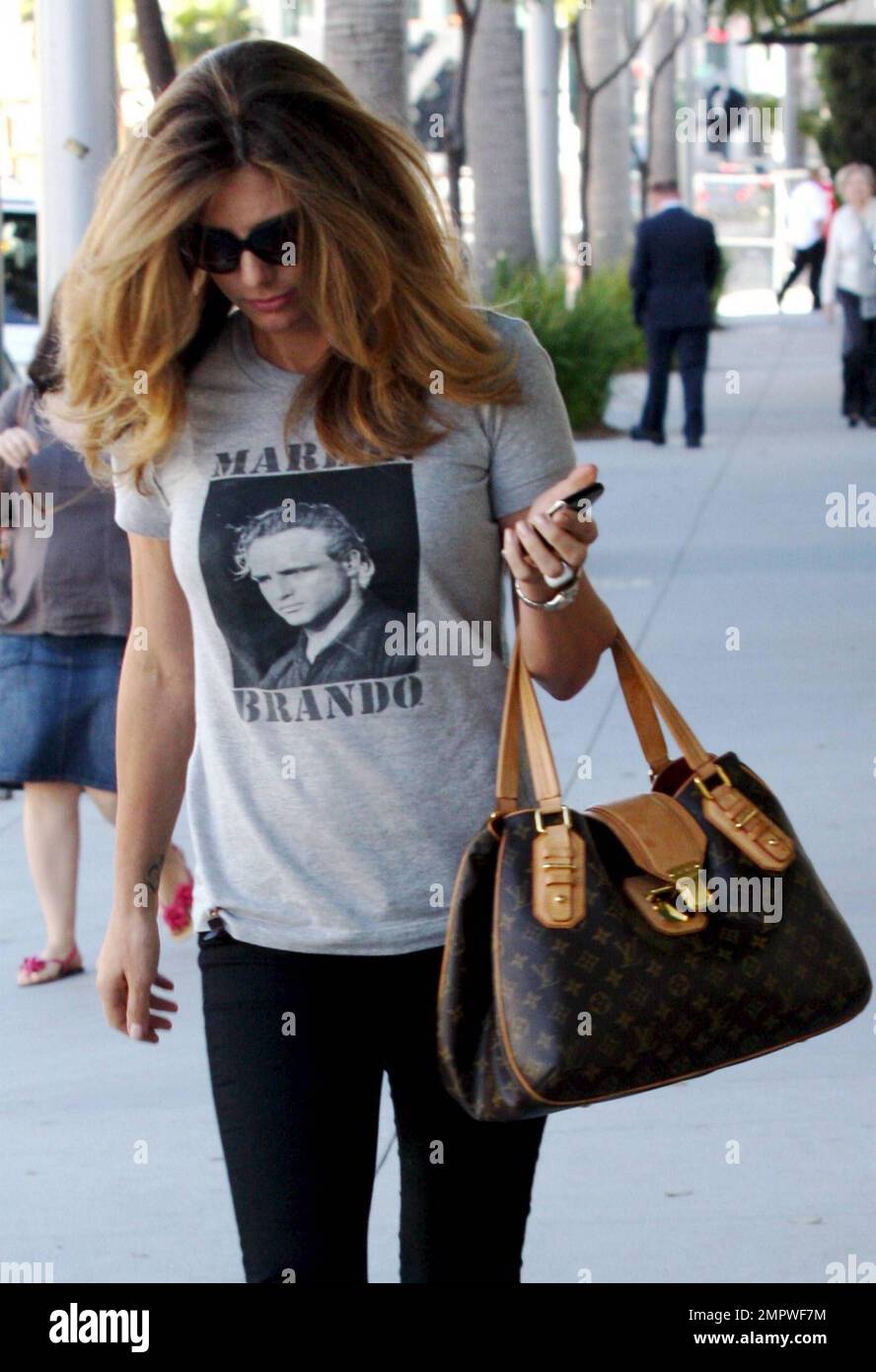Latin American actress and model Daisy Fuentes wears a Marlon Brando t  shirt as she shows off her luxurious locks while leaving a Beverly Hills hair  salon after an appointment. Los Angeles,