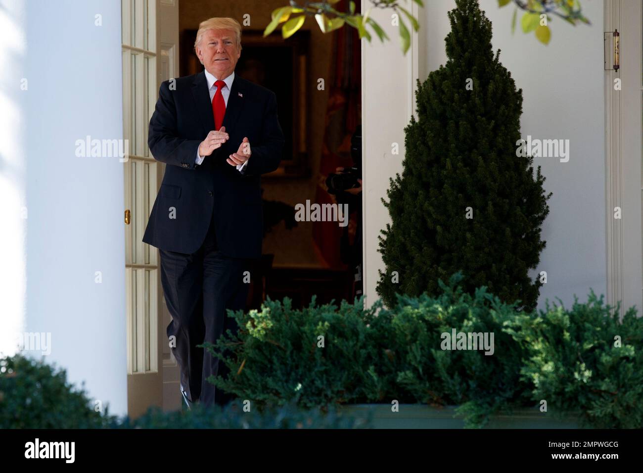 President Donald Trump walks out of the Oval Office before an event ...