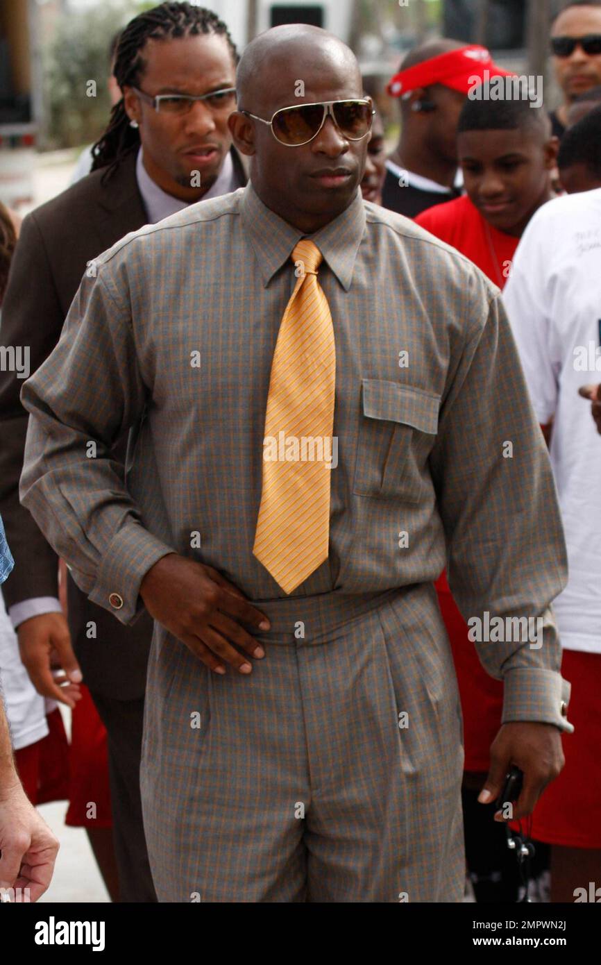 EXCLUSIVE Dion Sanders picks his teeth clean with a sheet of paper