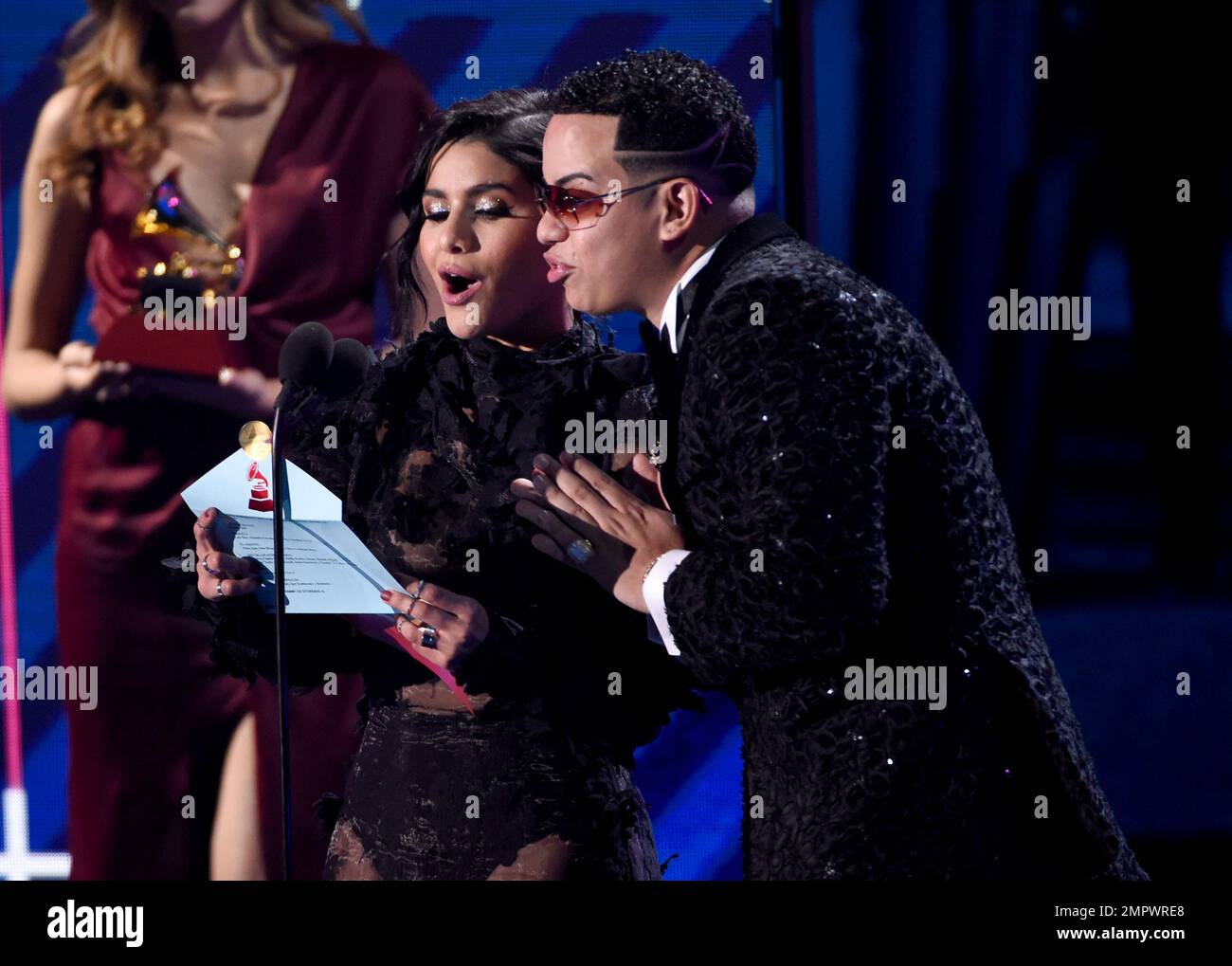 Martina la Peligrosa, left, and J'al Vareza present the award for best