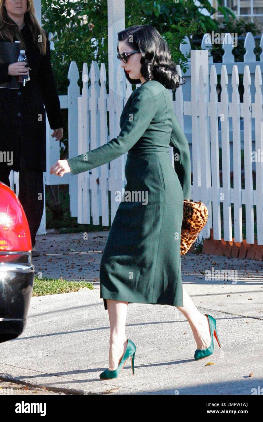 EXCLUSIVE!! Burlesque beauty Dita Von Teese looks stunning in a green  zippered pencil dress with matching heels as she leaves a business  appointment in Hollywood. Los Angeles, CA 12/8/09 Stock Photo - Alamy