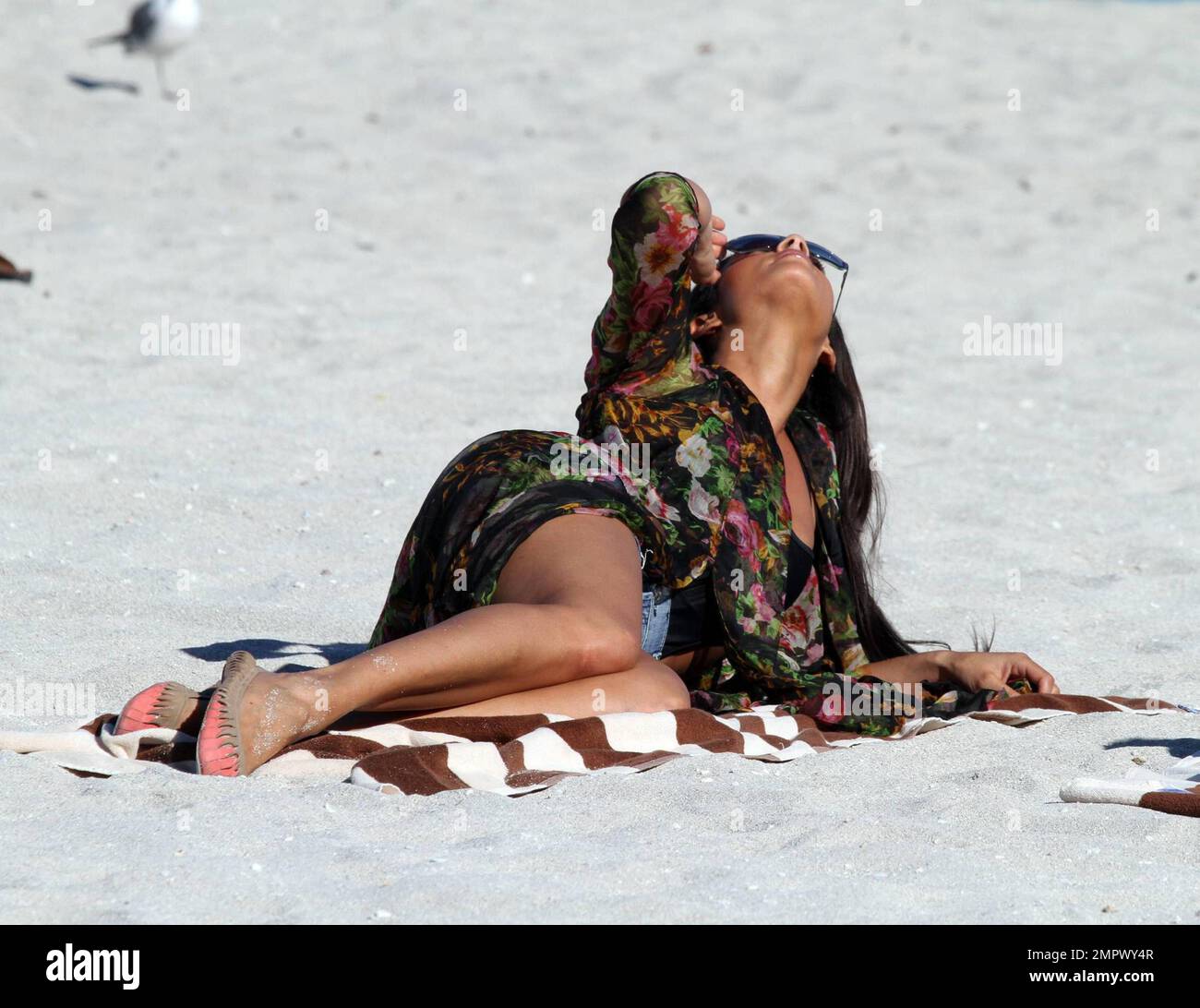 British songbird, Alesha Dixon, enjoys some relaxation beachside with pals following the filming of her new music video 