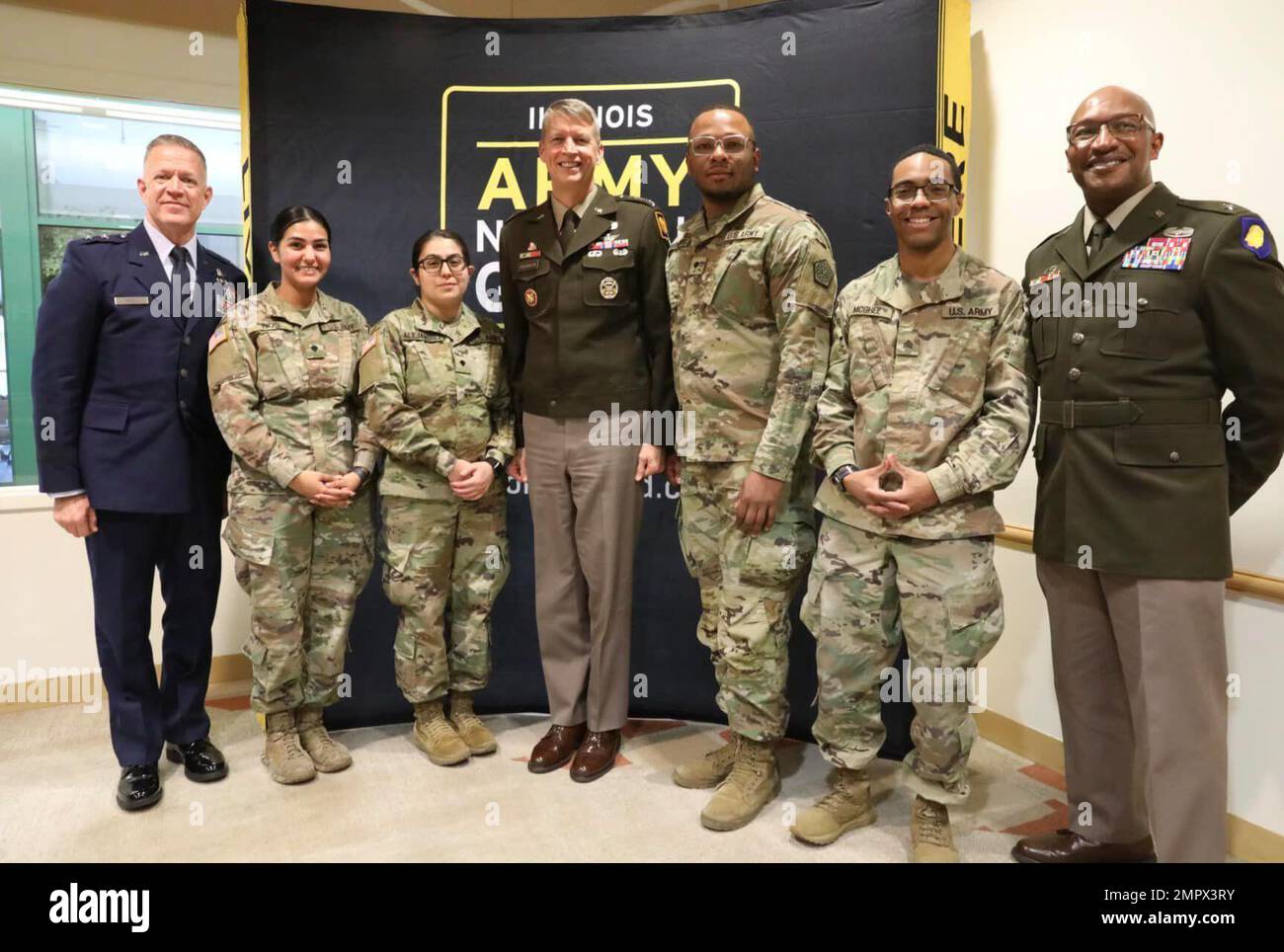 Air Force Maj. Gen. Rich Neely, the Adjutant General of Illinois and Commander of the Illinois National Guard, Spc. Clarissa Rios of Chicago, Spc. Lissette Alejandrez of Bensenville, Gen. Daniel Hokanson, Chief of the U.S. National Guard Bureau, Spc. Joshua Davenport of Chicago, Sgt. Joseph McGhee of Chicago and Brig. Gen. Rodney Boyd, Assistant Adjutant General - Army and Commander of the Illinois Army National Guard  (left to right) pose for a photograph at Chicago State University in Chicago. All  of the enlisted Soldiers are assigned to the 1970th Quartermaster Company out of North Riversi Stock Photo