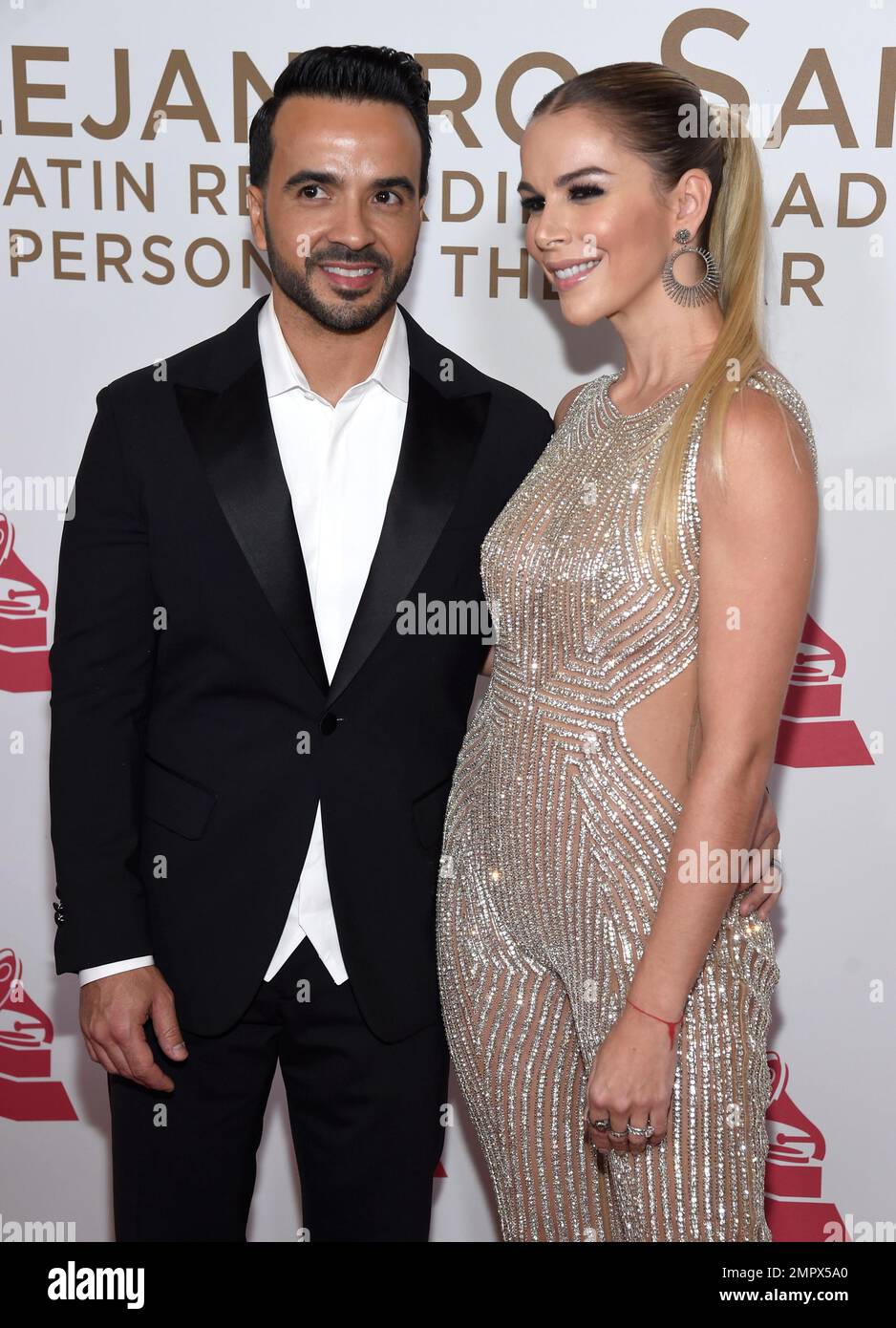 Luis Fonsi, left, and Agueda Lopez arrive at the Latin Recording