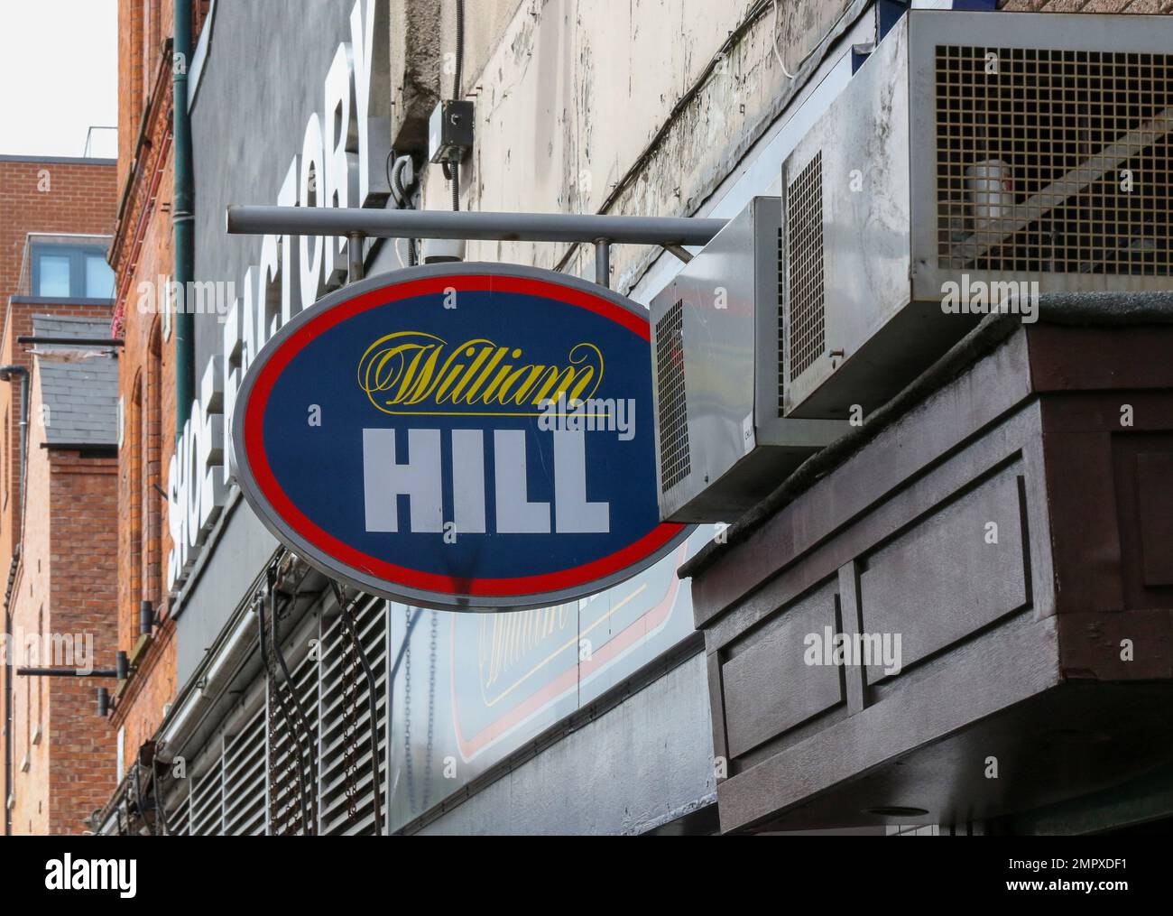 UK betting chain shop sign. William Hill sign on wall outside betting shop in UK. Stock Photo