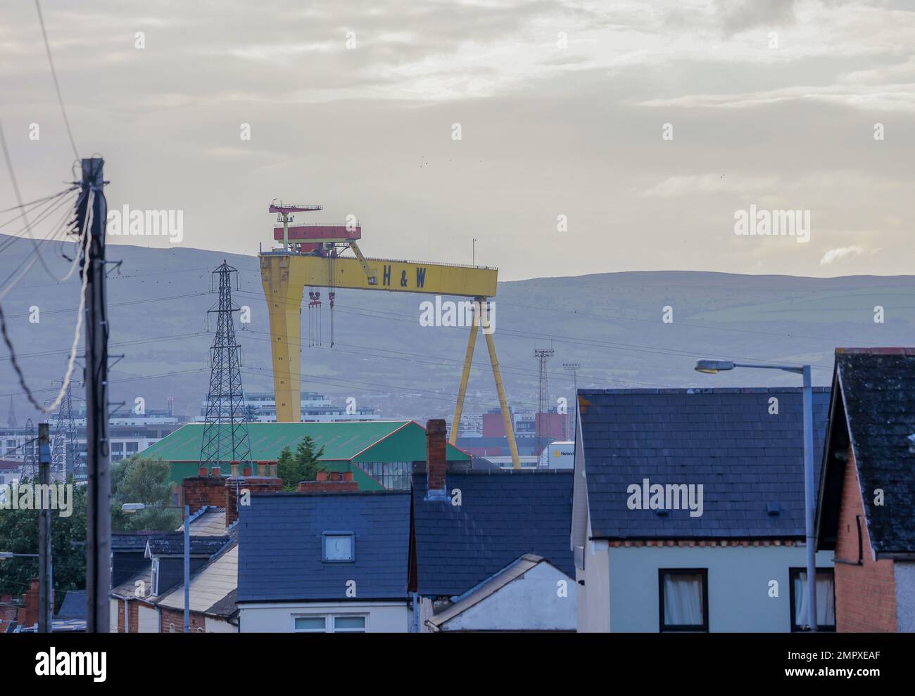 Autumn evening Belfast cityscape view across east Belfast Harland & Wolff crane shipyard. Stock Photo