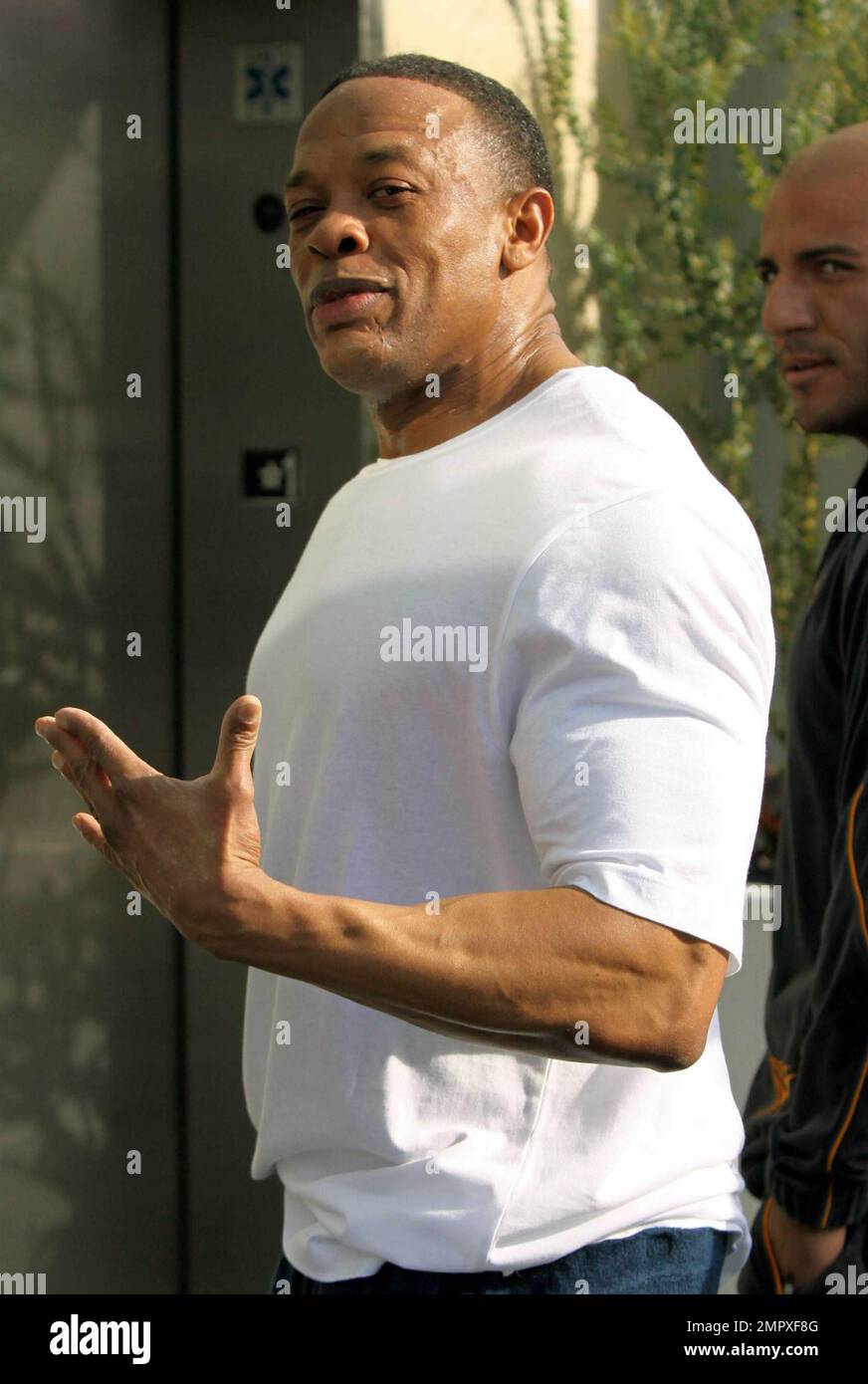 Rap music mogul Dr. Dre looks pumped up as he leaves the gym with a friend  in West Hollywood, CA. 1/5/11 Stock Photo - Alamy