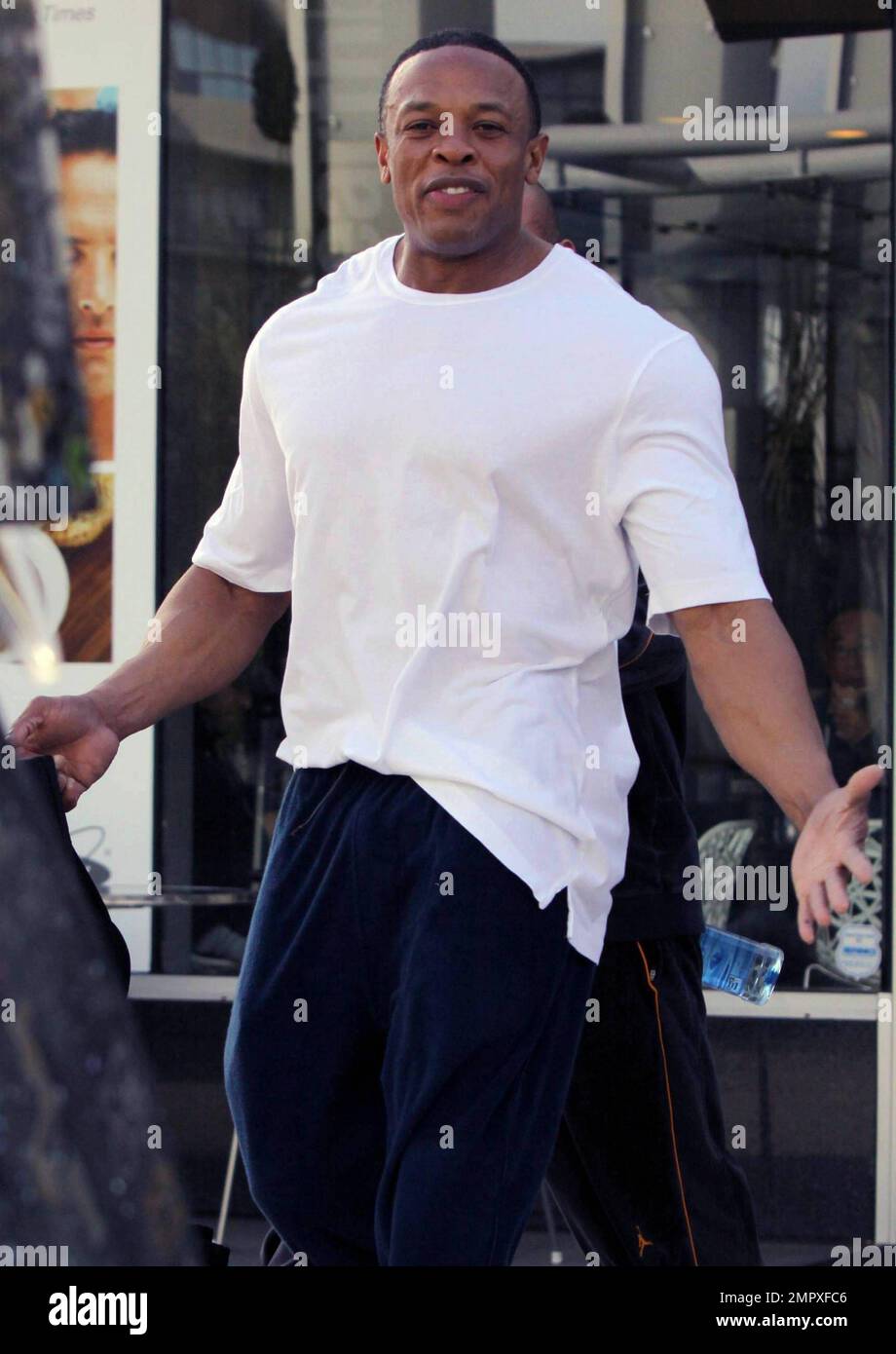 Rap music mogul Dr. Dre looks pumped up as he leaves the gym with a friend  in West Hollywood, CA. 1/5/11 Stock Photo - Alamy
