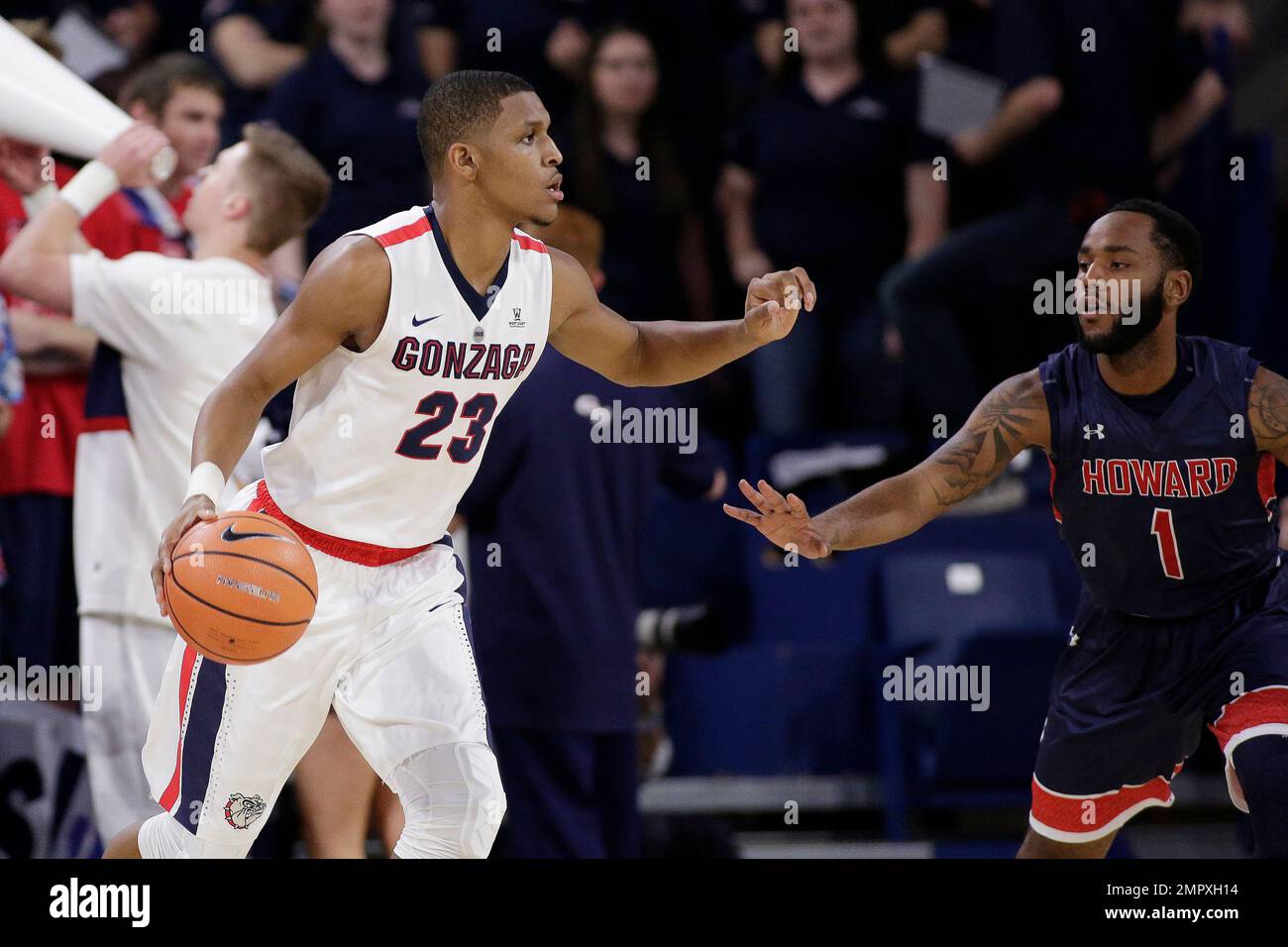 Gonzaga guard Zach Norvell Jr. (23) dribbles the ball while defended by Howard guard Kai Tease