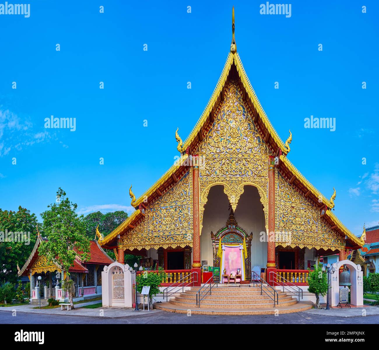 The scenic gilt floral patterns on the facade of the viharn in Wat Chiang Man temple, Chiang Mai, Thailand Stock Photo