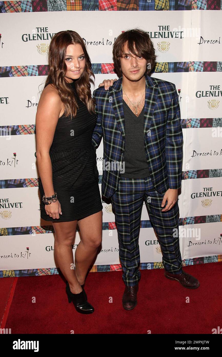 Singer Paolo Nutini (R) poses for photographers at the 9th Annual