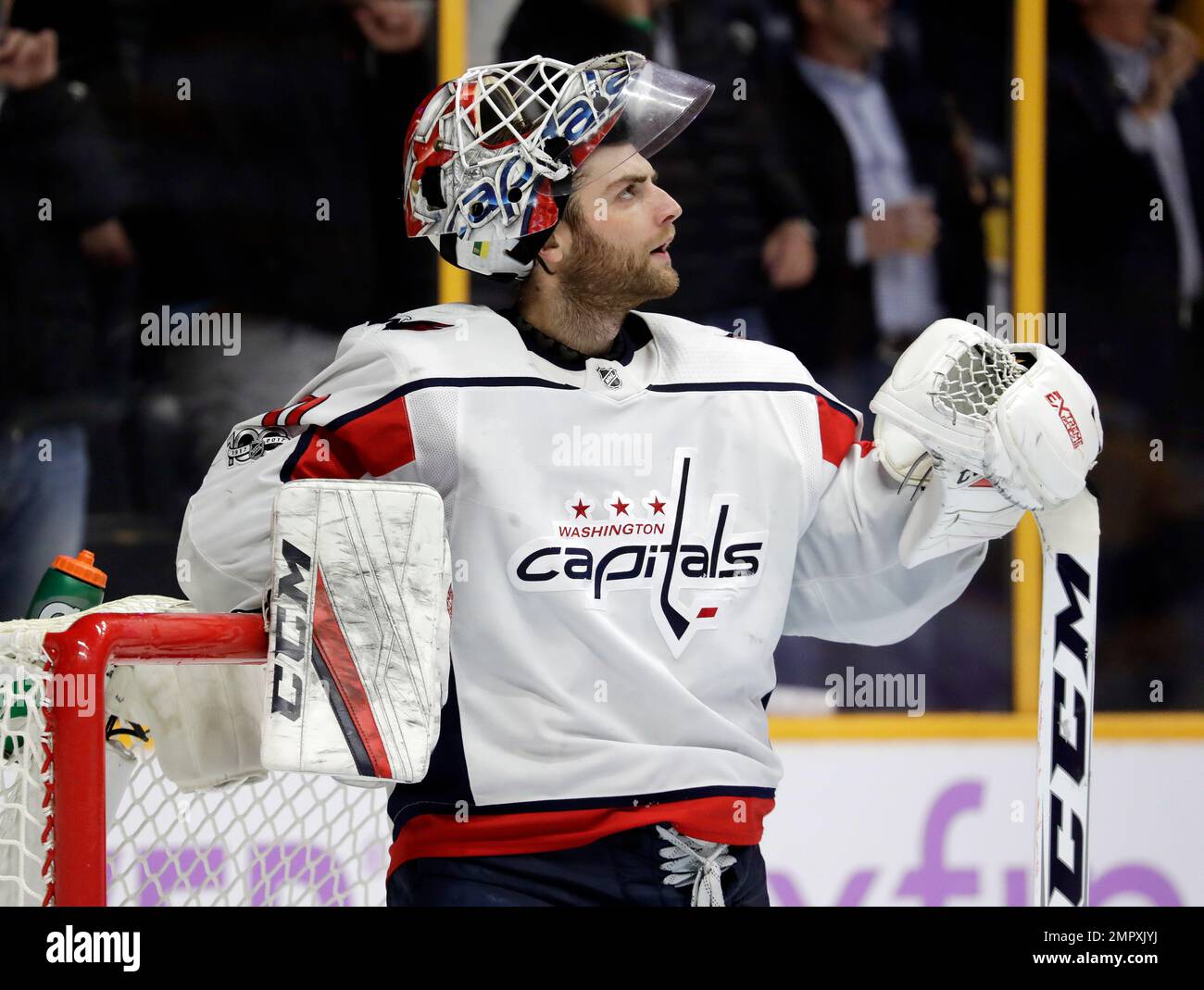 Washington Capitals goalie Braden Holtby watches the replay after giving up a goal against the Nashville Predators in the second period of an NHL hockey game Tuesday, Nov